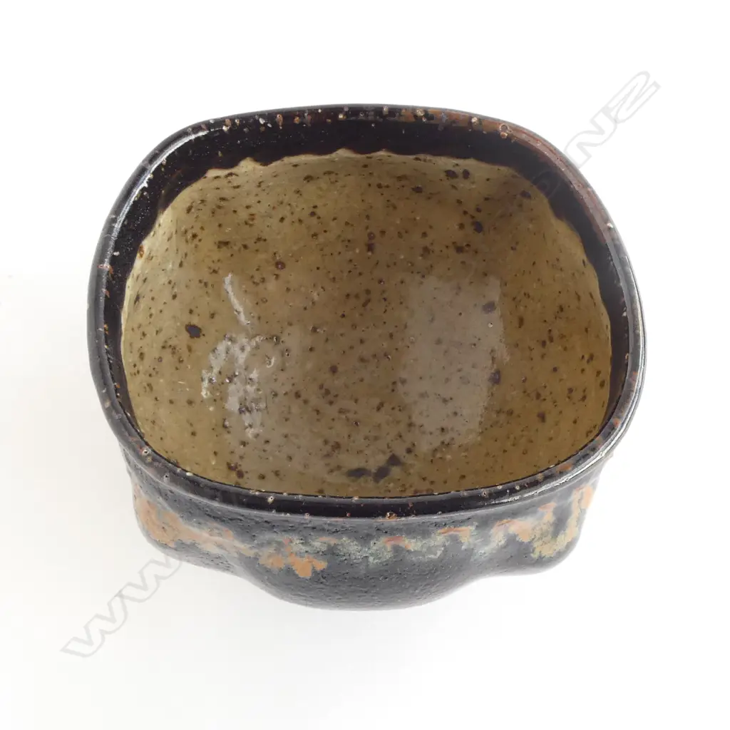 Barry Brickell (1935-2016) lobe sided stoneware bowl with lustrous tenmoko glazed square form with squiggle design under rim. Potter's mark impressed to side. H.150mm Image 1++