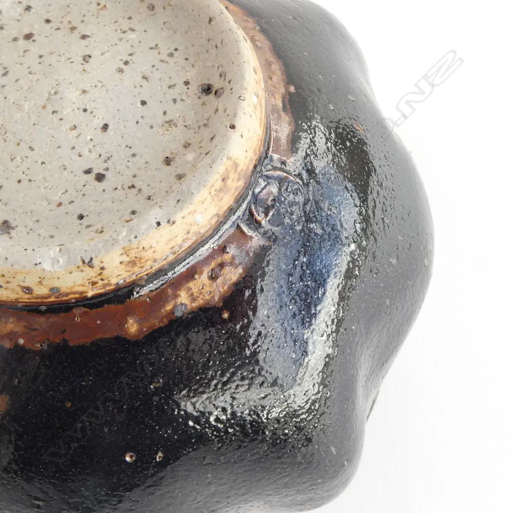 Barry Brickell (1935-2016) lobe sided stoneware bowl with lustrous tenmoko glazed square form with squiggle design under rim. Potter's mark impressed to side. H.150mm Image 1++