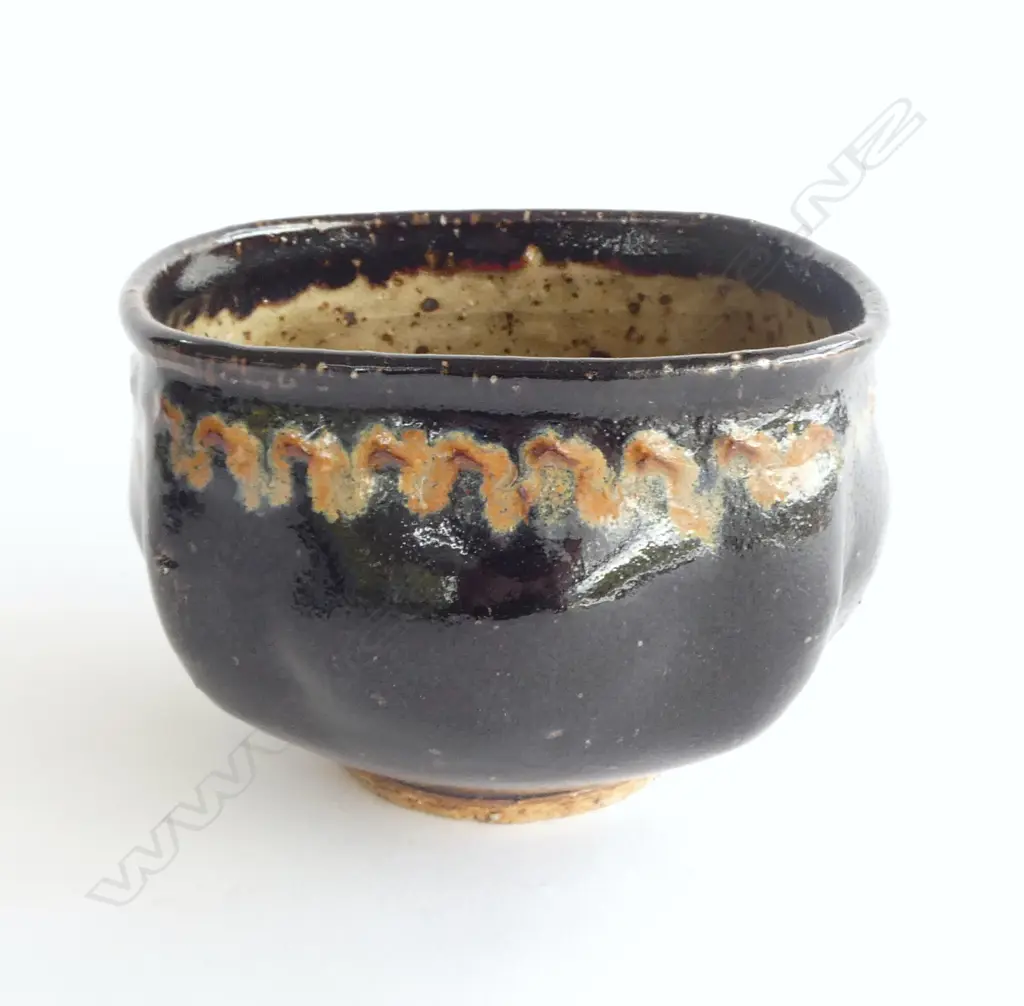 Barry Brickell (1935-2016) lobe sided stoneware bowl with lustrous tenmoko glazed square form with squiggle design under rim. Potter's mark impressed to side. H.150mm Image 1++
