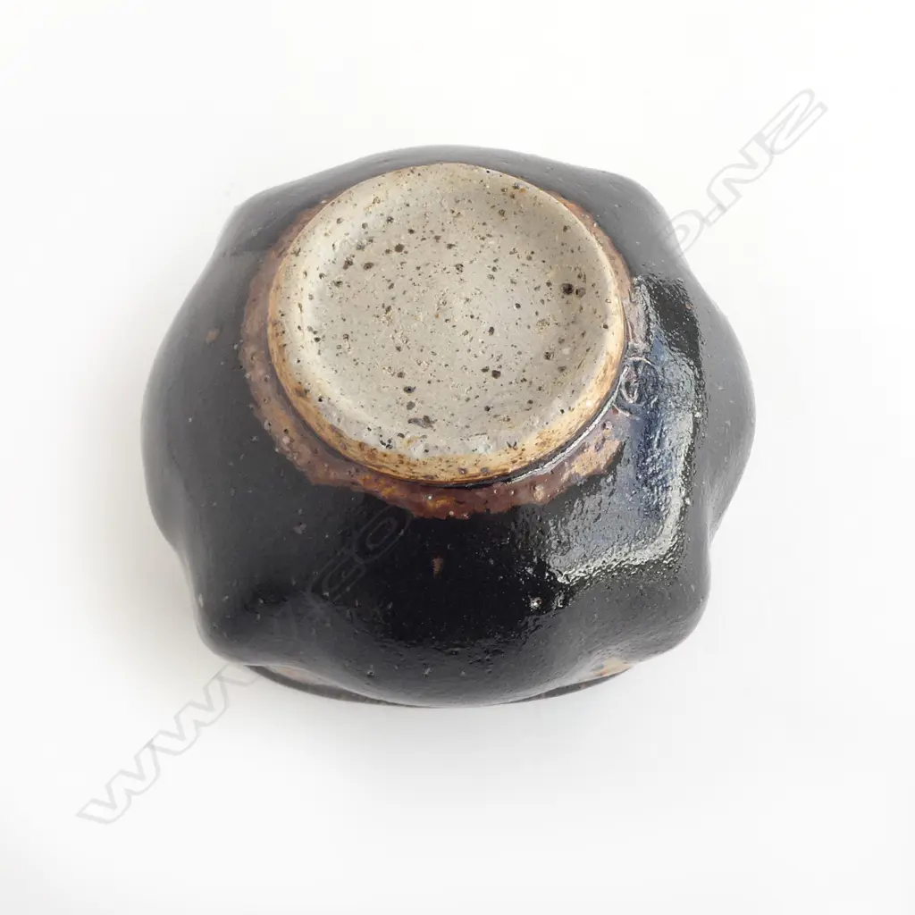 Barry Brickell (1935-2016) lobe sided stoneware bowl with lustrous tenmoko glazed square form with squiggle design under rim. Potter's mark impressed to side. H.150mm Image 1++