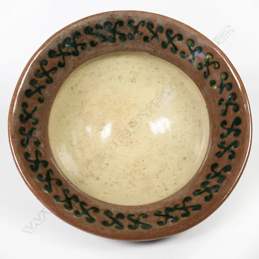 Barry Brickell (1935-2016) flared glazed terracotta bowl, red/brown glazed exterior and internal rim decorated with scrolled motif. Potter's mark lower side. H.110mm Dia.210mm Image 1++