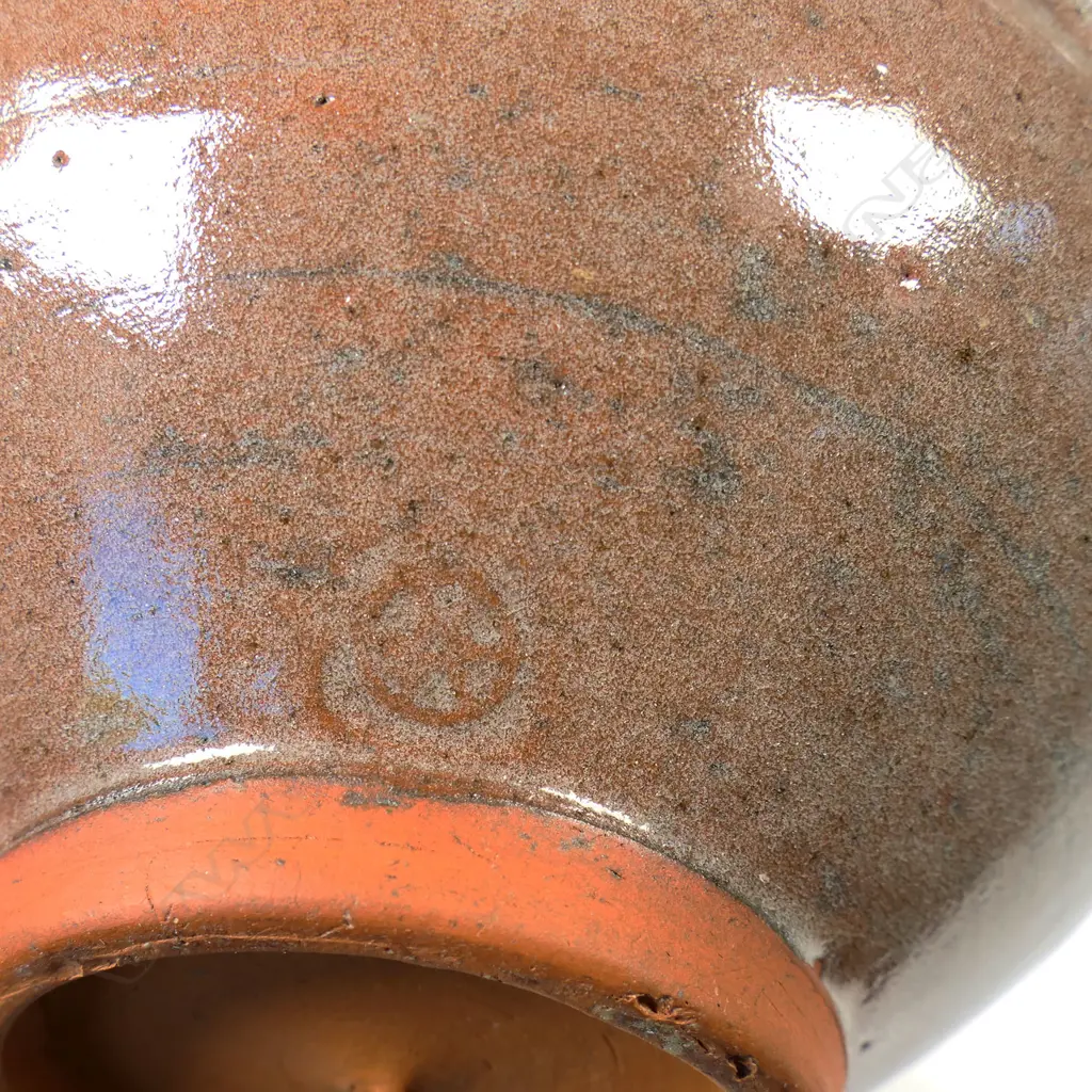 Barry Brickell (1935-2016) flared glazed terracotta bowl, red/brown glazed exterior and internal rim decorated with scrolled motif. Potter's mark lower side. H.110mm Dia.210mm Image 1++