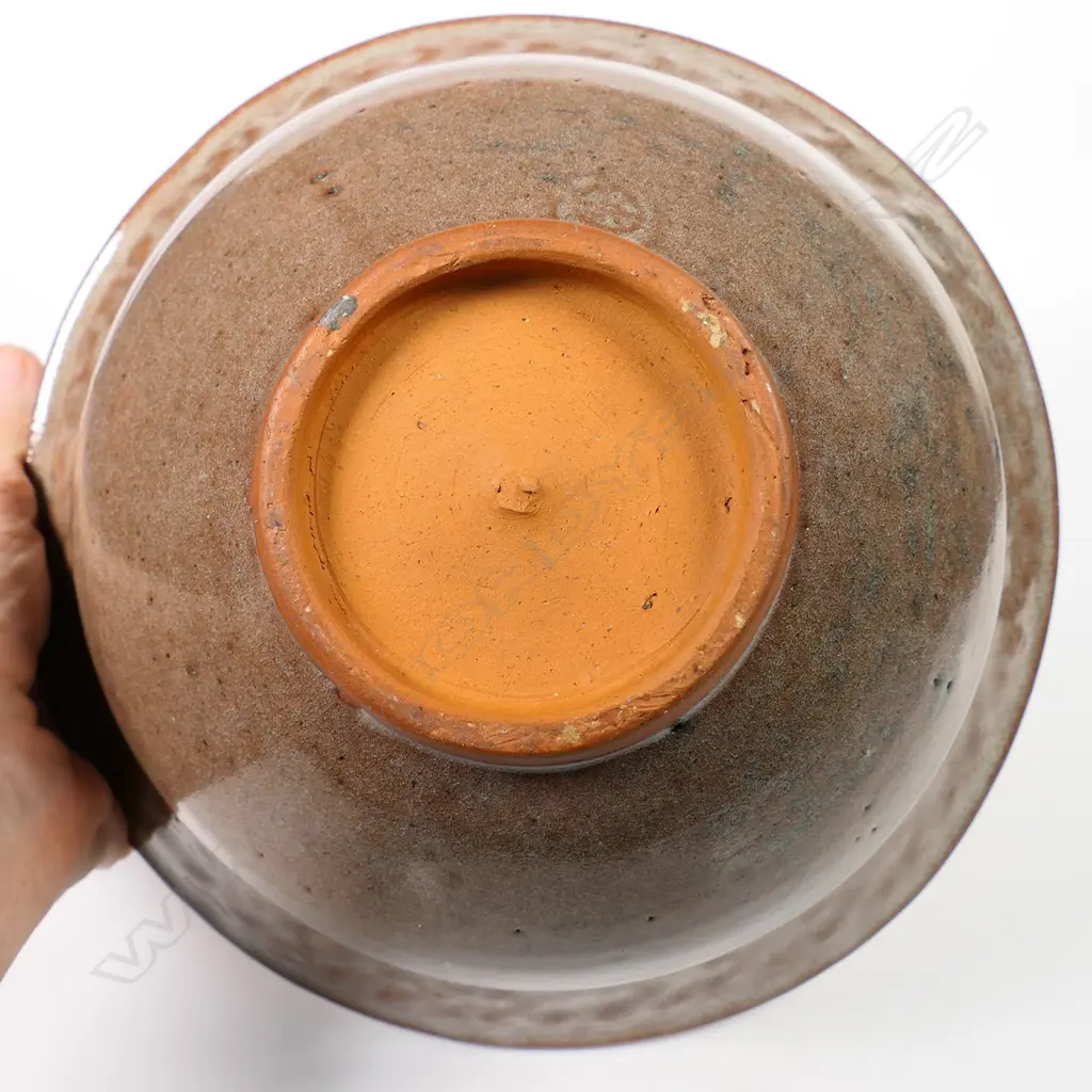 Barry Brickell (1935-2016) flared glazed terracotta bowl, red/brown glazed exterior and internal rim decorated with scrolled motif. Potter's mark lower side. H.110mm Dia.210mm Image 1++