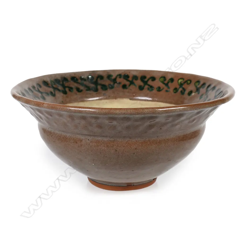 Barry Brickell (1935-2016) flared glazed terracotta bowl, red/brown glazed exterior and internal rim decorated with scrolled motif. Potter's mark lower side. H.110mm Dia.210mm Image 1++