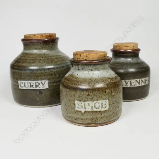 Three Len Castle spice jars with cork stoppers: Curry + Spice + Cayenne. Tallest 100mm. Vendor's note: Bought directly from the potter.