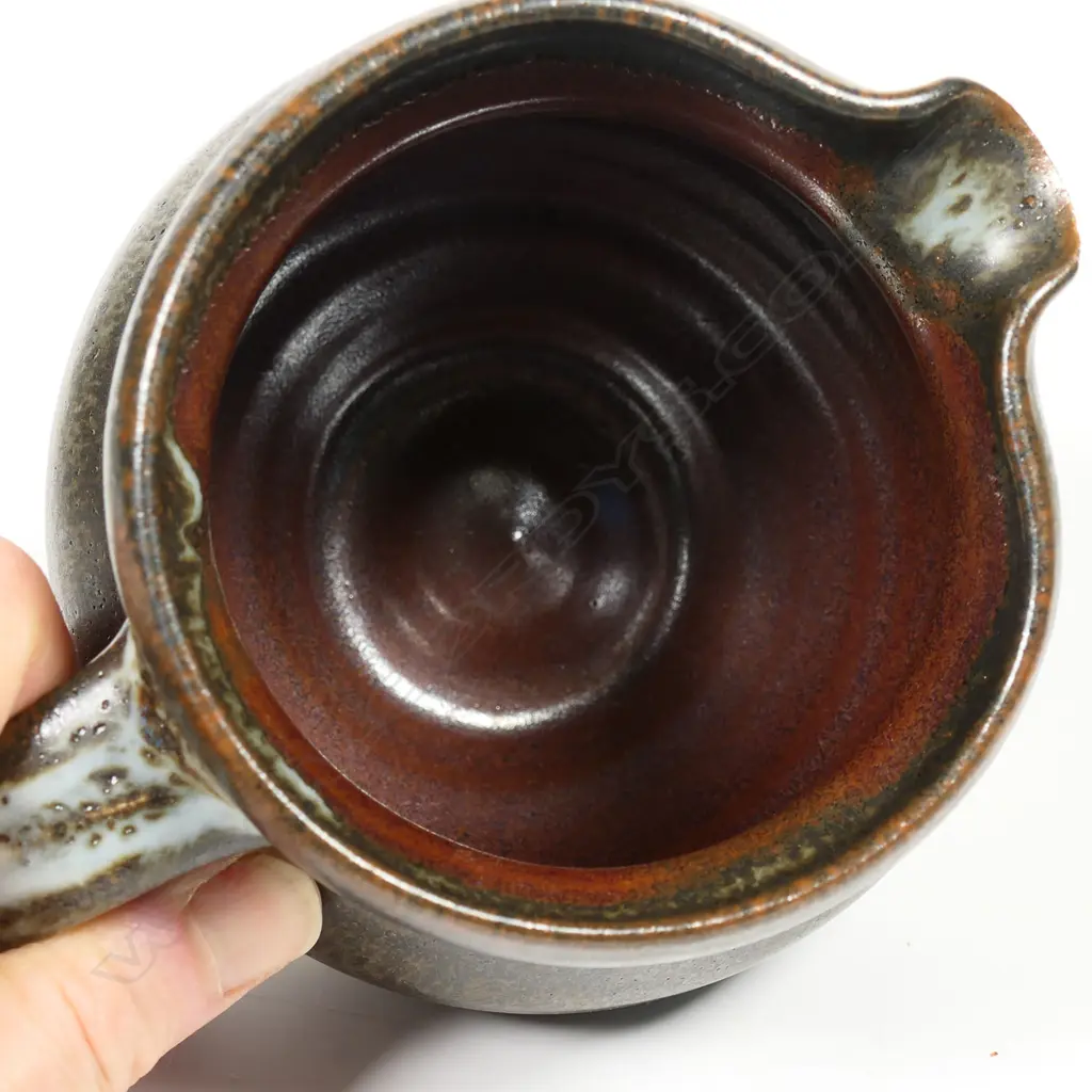 Len Castle jug spherical form ¾ dark green/brown glaze. Impressed mark. H.110mm. Vendor's note: Bought directly from the potter. Image 1++