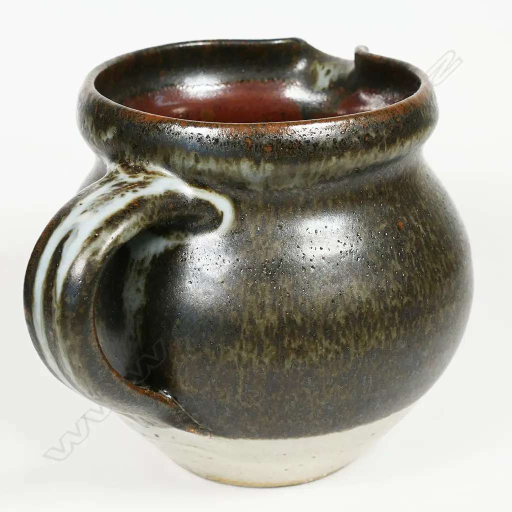 Len Castle jug spherical form ¾ dark green/brown glaze. Impressed mark. H.110mm. Vendor's note: Bought directly from the potter. Image 1++