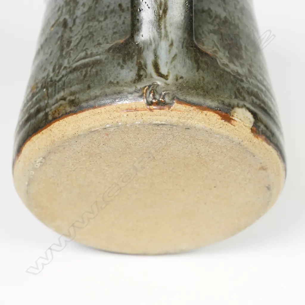 Len Castle jug of tapered cylinder form with variable dark grey glaze. Impressed mark. H.115mm. Vendor's note: Bought directly from the potter. Image 1++