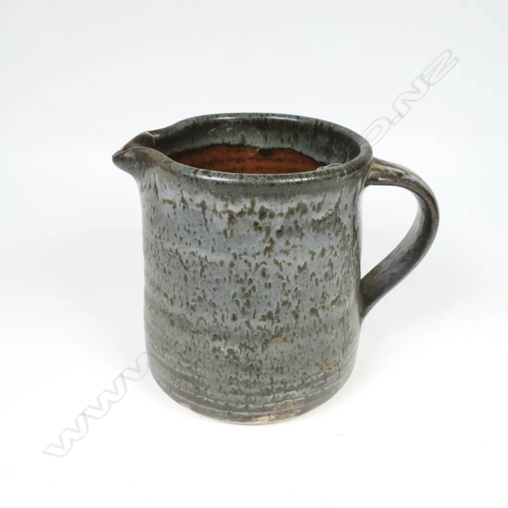 Len Castle jug of tapered cylinder form with variable dark grey glaze. Impressed mark. H.115mm. Vendor's note: Bought directly from the potter. Image 1++