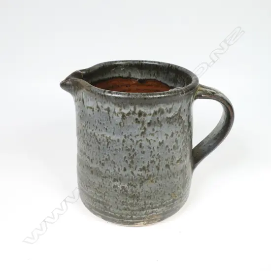Len Castle jug of tapered cylinder form with variable dark grey glaze. Impressed mark. H.115mm. Vendor's note: Bought directly from the potter.
