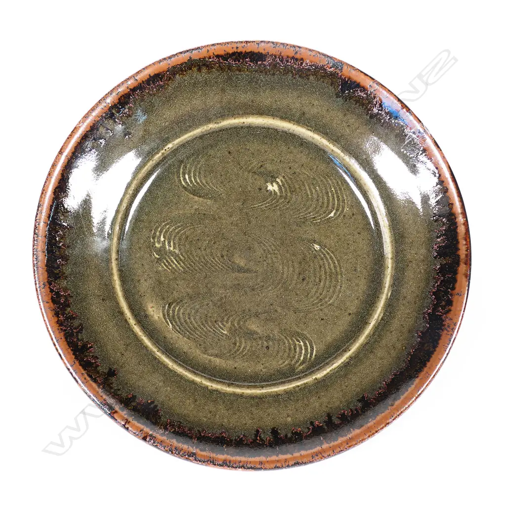 Len Castle small plate combed repeating decoration dark green/grey over tenmoku. Dia.165mm. Vendor's note: Bought directly from the potter. Image 1++