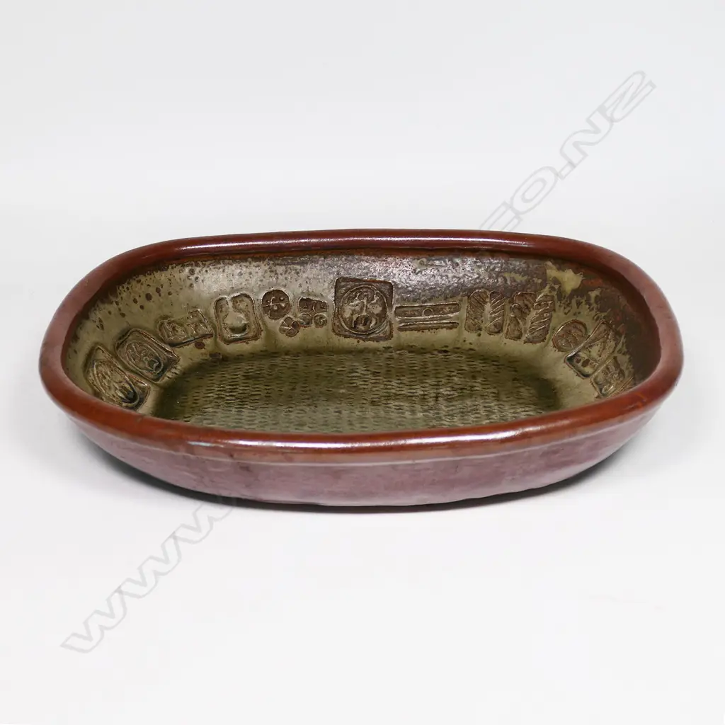 Len Castle large early press moulded dish of rounded rectangular form, impressed with various motifs and tenmoku overglaze. 410 x 330mm Image 1++