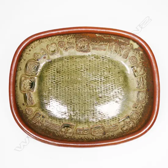 Len Castle large early press moulded dish of rounded rectangular form, impressed with various motifs and tenmoku overglaze. 410 x 330mm