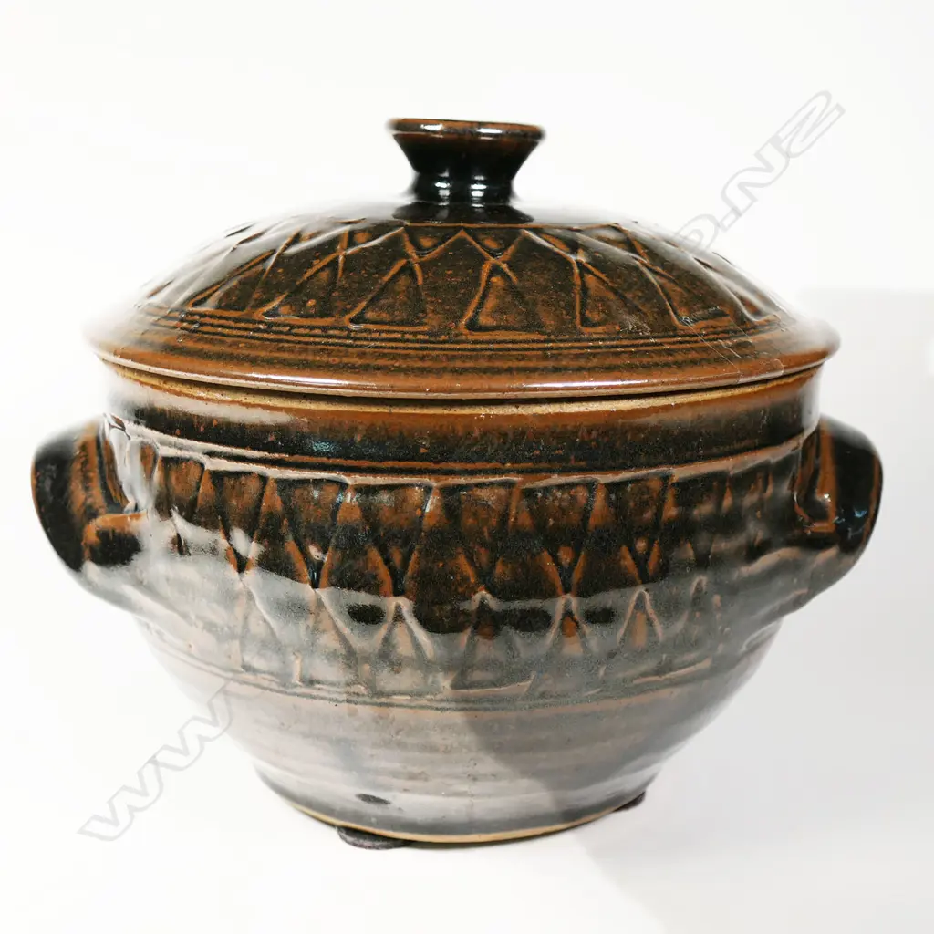 Mirek Smisek (1925-2013) lidded casserole dish. Tenmoko glaze with band of diamond trellis design to lid and sides. Potter's mark lower side. H.210mm Dia.230mm Image 1++
