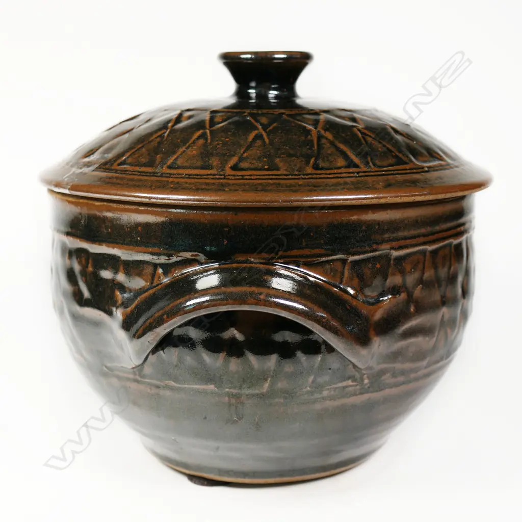 Mirek Smisek (1925-2013) lidded casserole dish. Tenmoko glaze with band of diamond trellis design to lid and sides. Potter's mark lower side. H.210mm Dia.230mm Image 1++