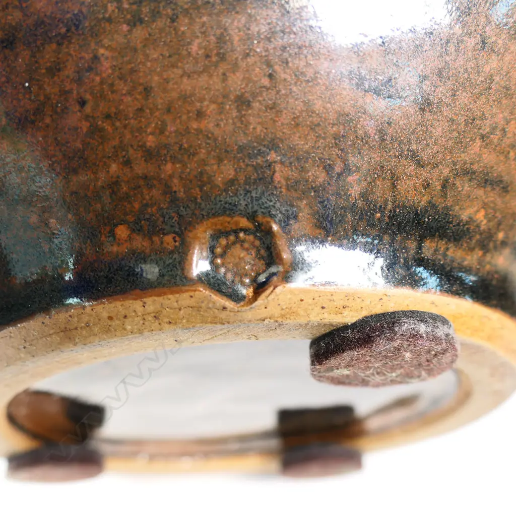 Mirek Smisek (1925-2013) lidded casserole dish. Tenmoko glaze with band of diamond trellis design to lid and sides. Potter's mark lower side. H.210mm Dia.230mm Image 1++