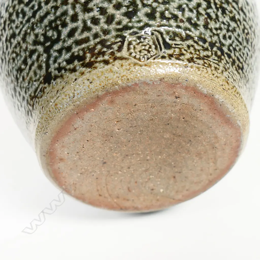 Mirek Smisek early salt glazed jug with a mottled grey/brown glaze and band of finely incised pattern to middle. Impressed potter's mark. H.170mm Image 1++