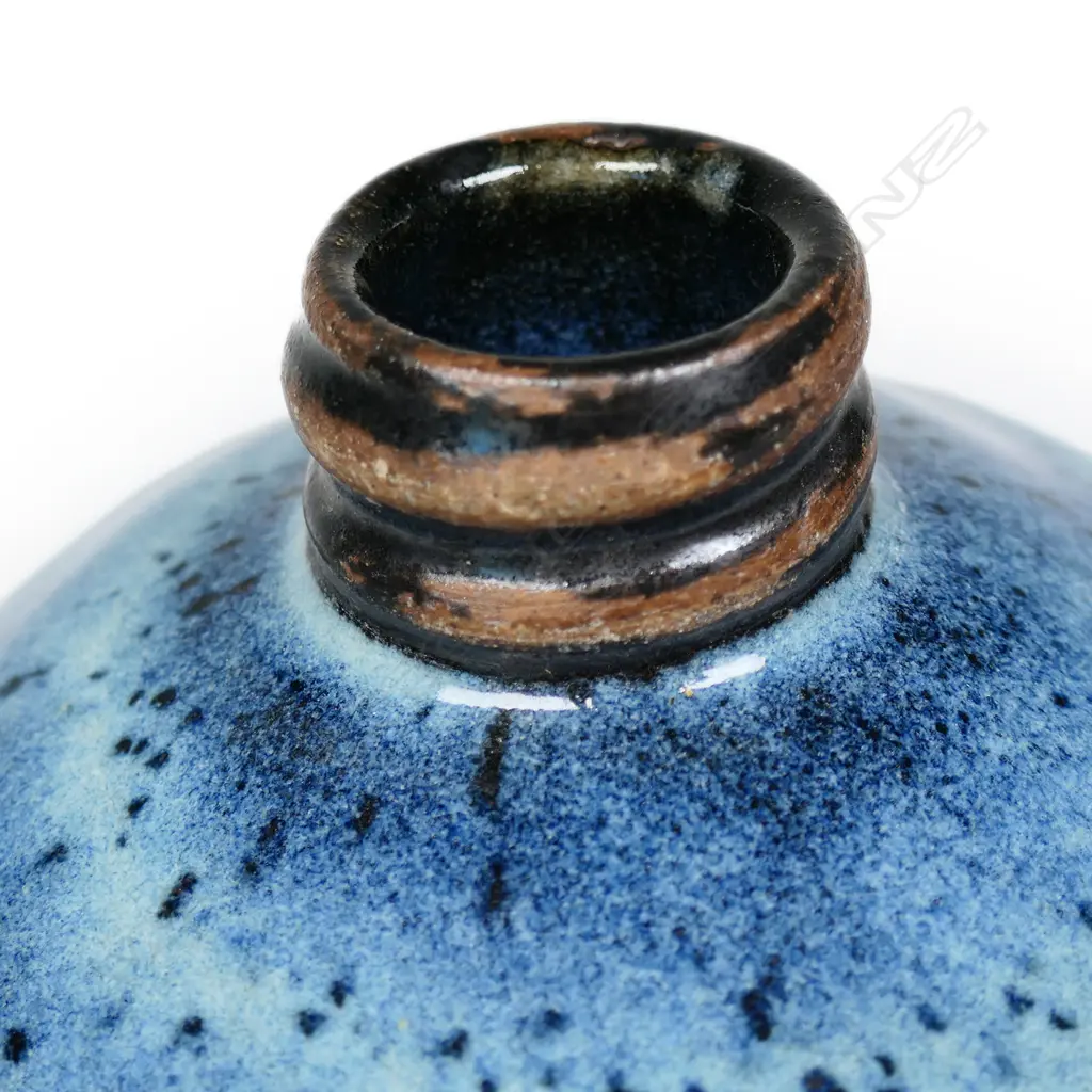 Peter Stichbury chun glazed large-sized tea caddy with screw lid -  speckled pale and blue glaze effects with matte black glaze band to the base of the lid and body. Impressed potter's mark. H.180mm.  Provenance: From a potter's collection. Image 1++