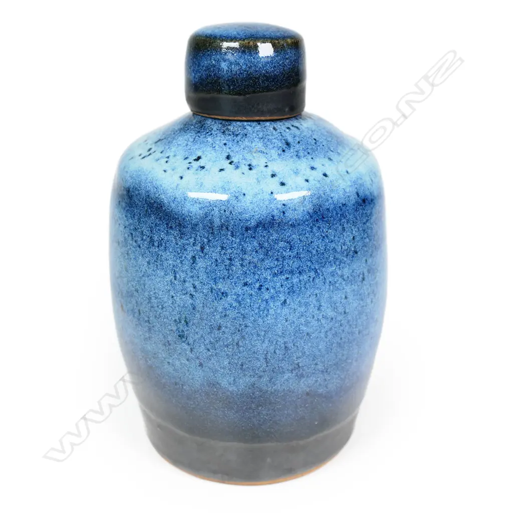 Peter Stichbury chun glazed large-sized tea caddy with screw lid -  speckled pale and blue glaze effects with matte black glaze band to the base of the lid and body. Impressed potter's mark. H.180mm.  Provenance: From a potter's collection. Image 1++