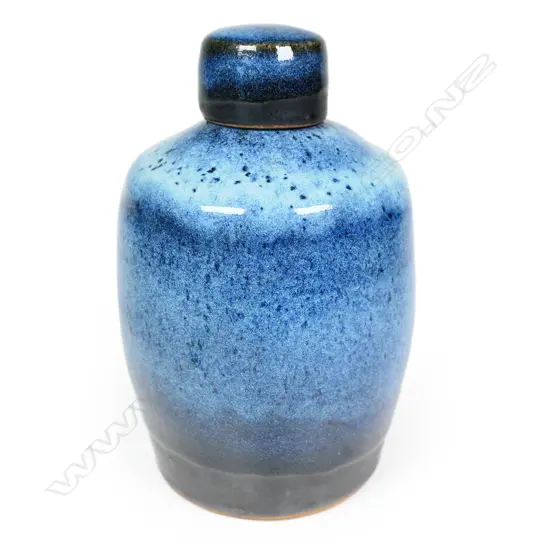 Peter Stichbury chun glazed large-sized tea caddy with screw lid -  speckled pale and blue glaze effects with matte black glaze band to the base of the lid and body. Impressed potter's mark. H.180mm.  Provenance: From a potter's collection.