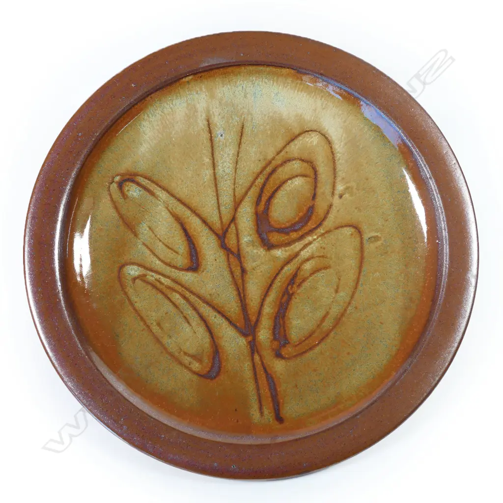 Peter Stichbury footed dish; tenmoko glazed rim with central wax resist organic design. Makers mark to foot. Dia.290mm Image 1++