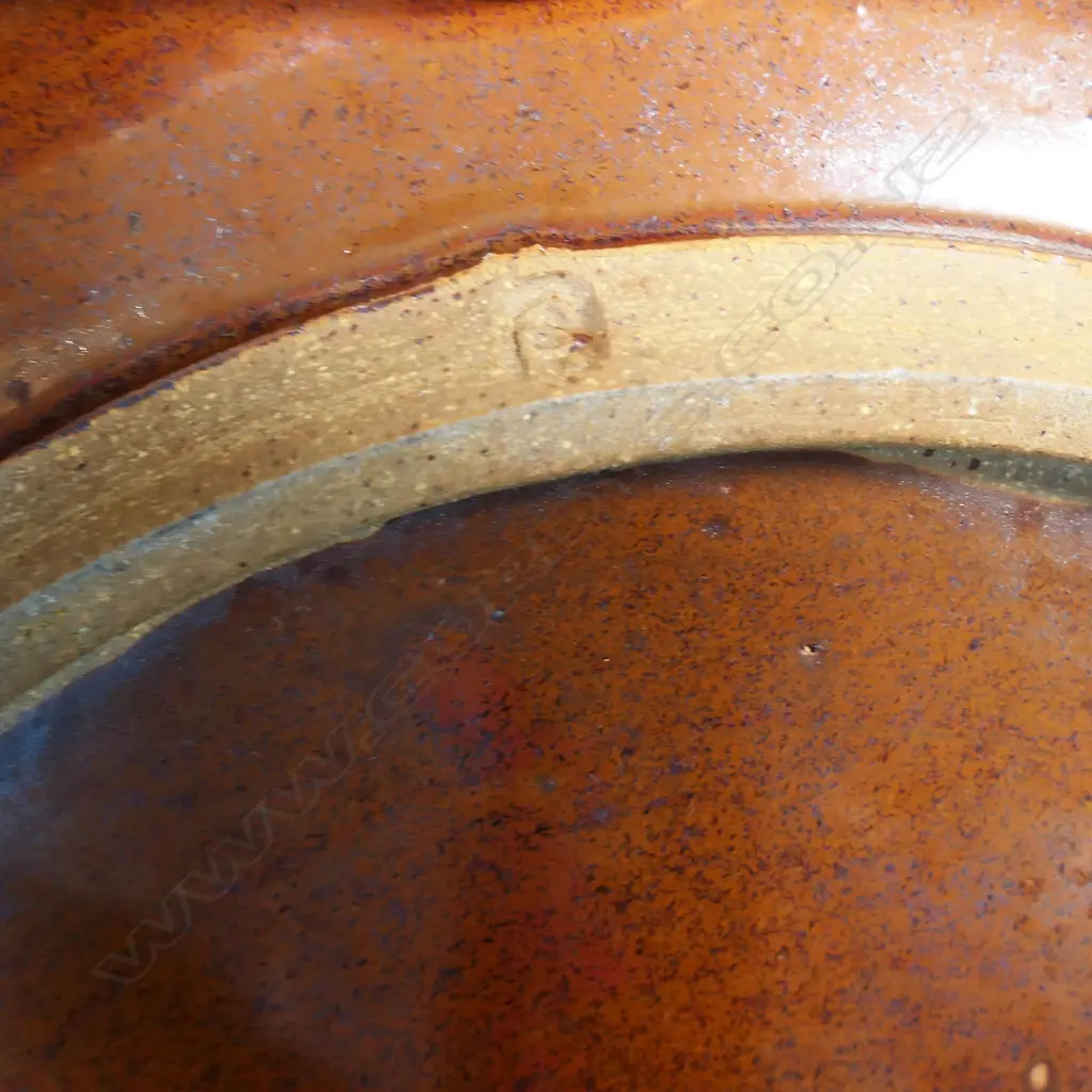 Peter Stichbury footed dish; tenmoko glazed rim with central wax resist organic design. Makers mark to foot. Dia.290mm Image 1++