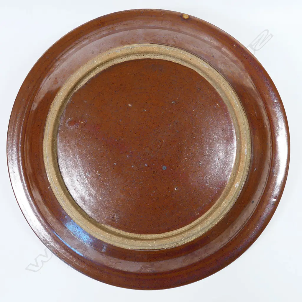 Peter Stichbury footed dish; tenmoko glazed rim with central wax resist organic design. Makers mark to foot. Dia.290mm Image 1++