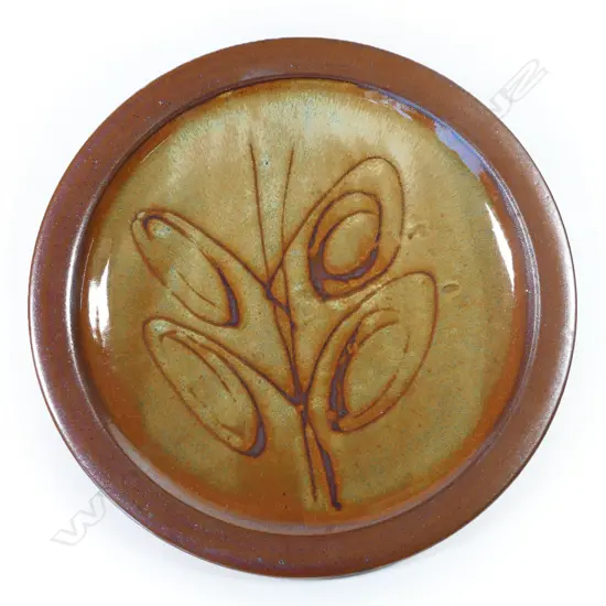 Peter Stichbury footed dish; tenmoko glazed rim with central wax resist organic design. Makers mark to foot. Dia.290mm