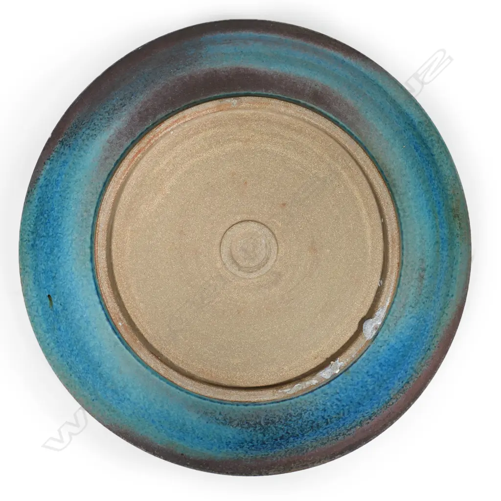Graeme Storm large shallow stoneware dish with central incised floral decoration and variable blue and brown matte glazes. Impressed mark to foot. Dia.470mm Image 1++