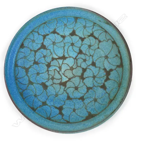 Graeme Storm large shallow stoneware dish with central incised floral decoration and variable blue and brown matte glazes. Impressed mark to foot. Dia.470mm