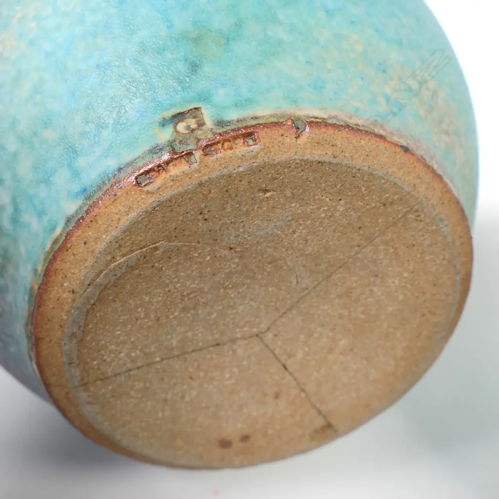 Two Graeme Storm pottery pieces - both with faults, turquoise glazed footed bowl with central well, small chip and glaze loss to rim, dia.200mm. Ovoid vase with lug handle, chip to lip and star crack to base, 150mm. Potter's mark to base of both. Image 1++