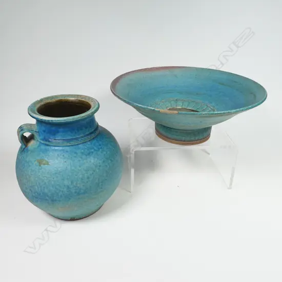 Two Graeme Storm pottery pieces - both with faults, turquoise glazed footed bowl with central well, small chip and glaze loss to rim, dia.200mm. Ovoid vase with lug handle, chip to lip and star crack to base, 150mm. Potter's mark to base of both.