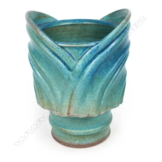 Graeme Storm blue urn vase; variable blue glazed body with applied ribbed straps. Potter's mark to foot. H.160mm