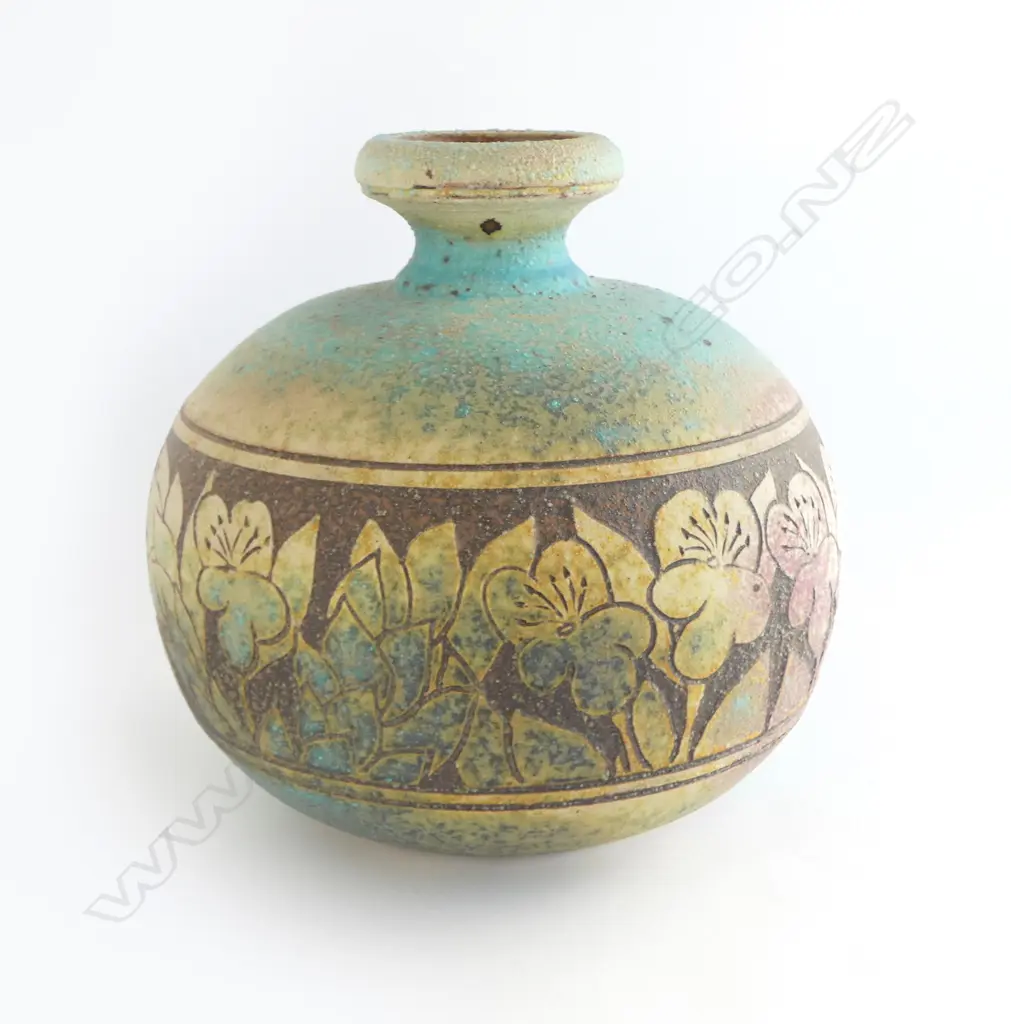 Graeme Storm stoneware vase - spherical body with flared neck and wide band of incised floral decoration. Impressed potter's mark. H.240mm. Image 1++