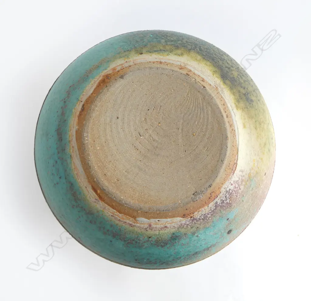 Graeme Storm stoneware vase - spherical body with flared neck and wide band of incised floral decoration. Impressed potter's mark. H.240mm. Image 1++