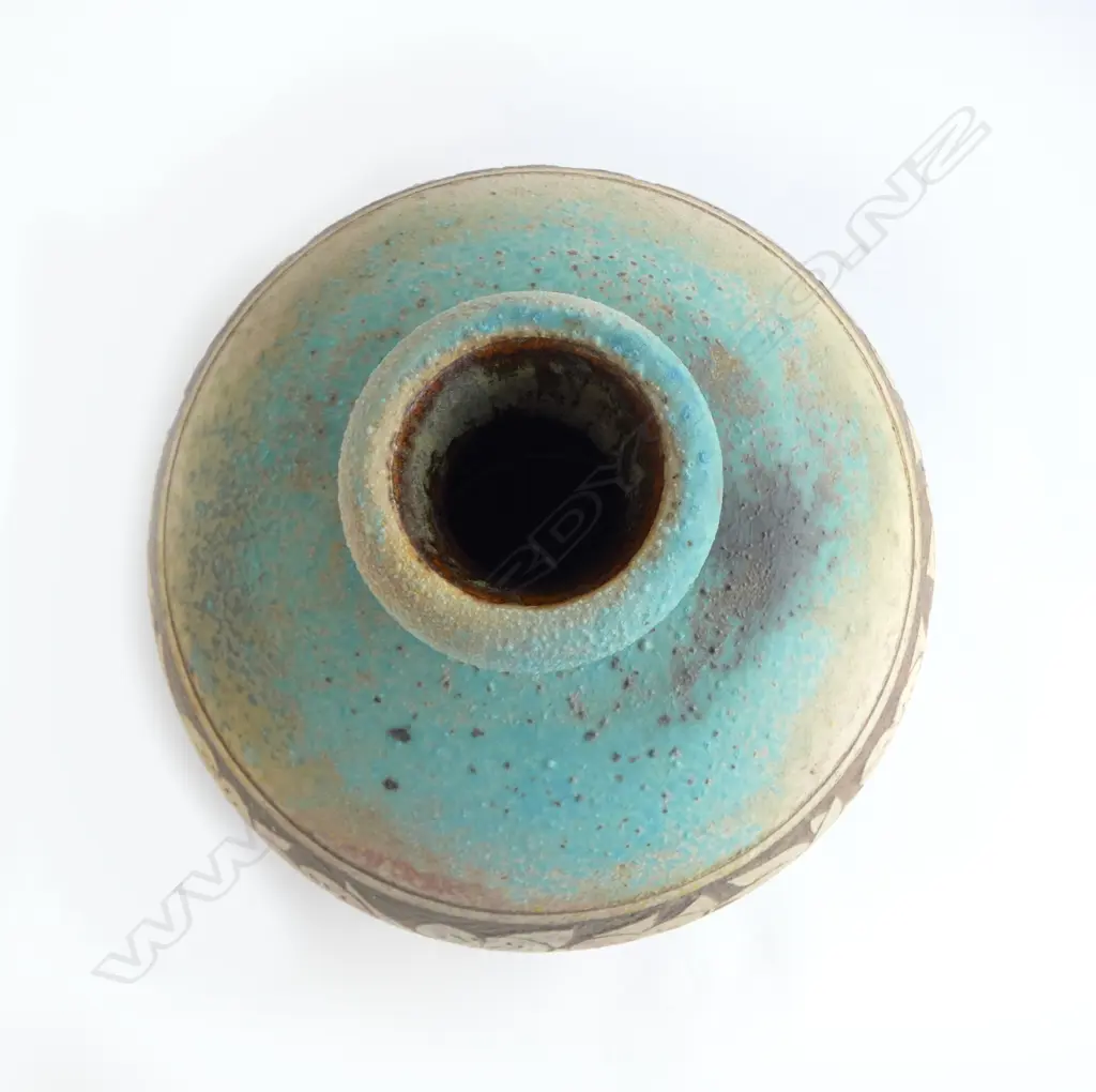 Graeme Storm stoneware vase - spherical body with flared neck and wide band of incised floral decoration. Impressed potter's mark. H.240mm. Image 1++