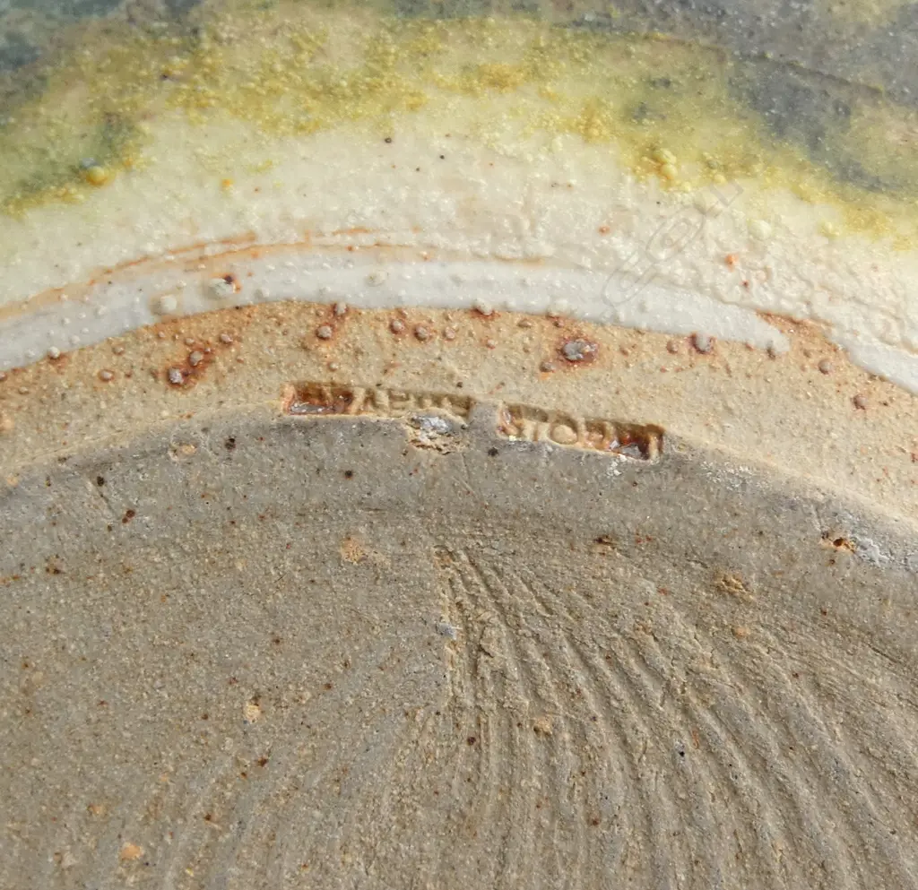 Graeme Storm stoneware vase - spherical body with flared neck and wide band of incised floral decoration. Impressed potter's mark. H.240mm. Image 1++