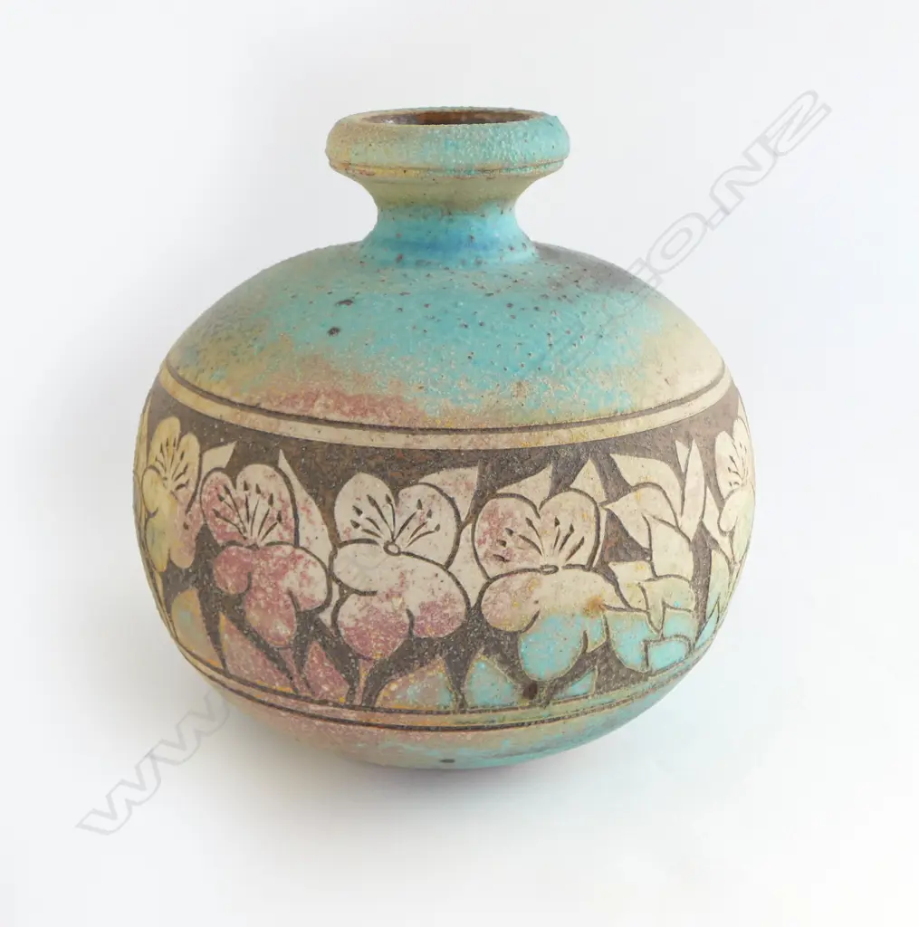 Graeme Storm stoneware vase - spherical body with flared neck and wide band of incised floral decoration. Impressed potter's mark. H.240mm. Image 1++