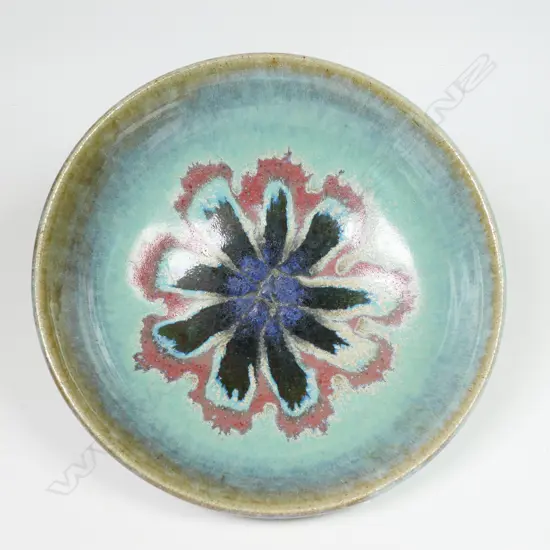 Graeme Storm footed bowl - pale turquoise glazed with internal pink and blue radiating floral motif. H.60 dia 200mm