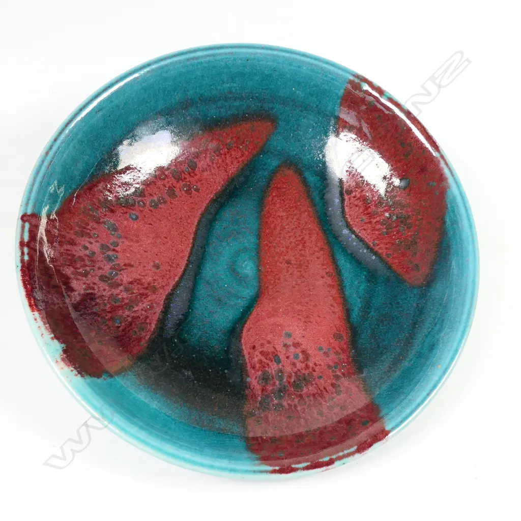 Graeme Storm shallow footed bowl -  green underglaze with sweeps of red copper glaze. Potter's stamp to foot. Dia.210mm Image 1++