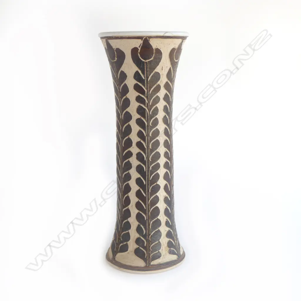 Graeme Storm tall mildly flared vase with sgraffito cut slip floral decoration. Small repaired chip under top lip. Impressed potter's mark. H.380mm. Vendor's note: Bought directly from the potter. Image 1++