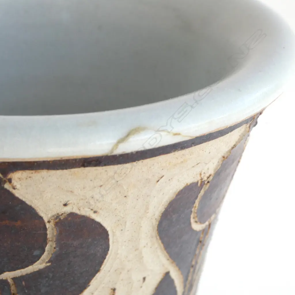 Graeme Storm tall mildly flared vase with sgraffito cut slip floral decoration. Small repaired chip under top lip. Impressed potter's mark. H.380mm. Vendor's note: Bought directly from the potter. Image 1++