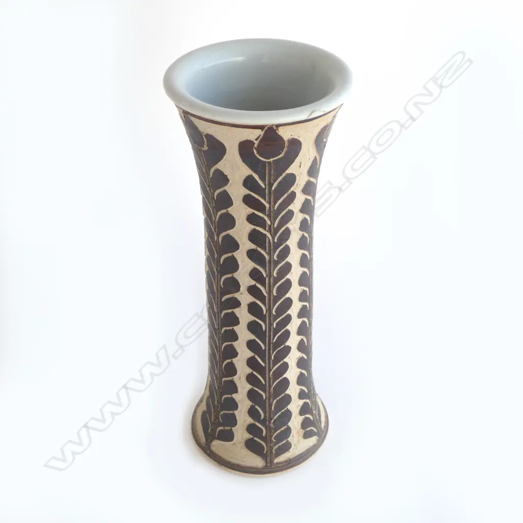 Graeme Storm tall mildly flared vase with sgraffito cut slip floral decoration. Small repaired chip under top lip. Impressed potter's mark. H.380mm. Vendor's note: Bought directly from the potter. Image 1++