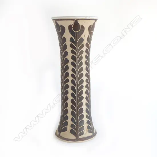 Graeme Storm tall mildly flared vase with sgraffito cut slip floral decoration. Small repaired chip under top lip. Impressed potter's mark. H.380mm. Vendor's note: Bought directly from the potter.