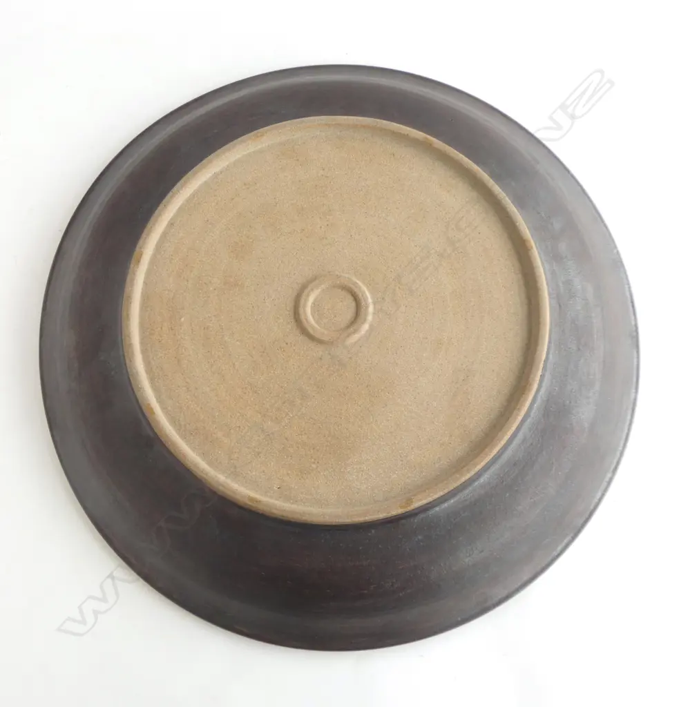 Graeme Storm large shallow stoneware dish with central blue, green & black transitioning rings and blue-black exterior. Potter's mark to foot. Dia.450mm Image 1++