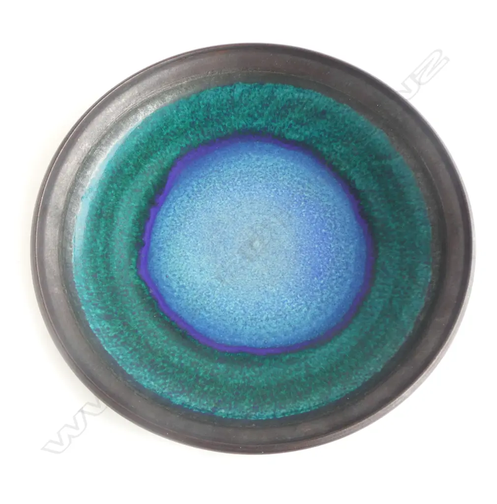 Graeme Storm large shallow stoneware dish with central blue, green & black transitioning rings and blue-black exterior. Potter's mark to foot. Dia.450mm Image 1++