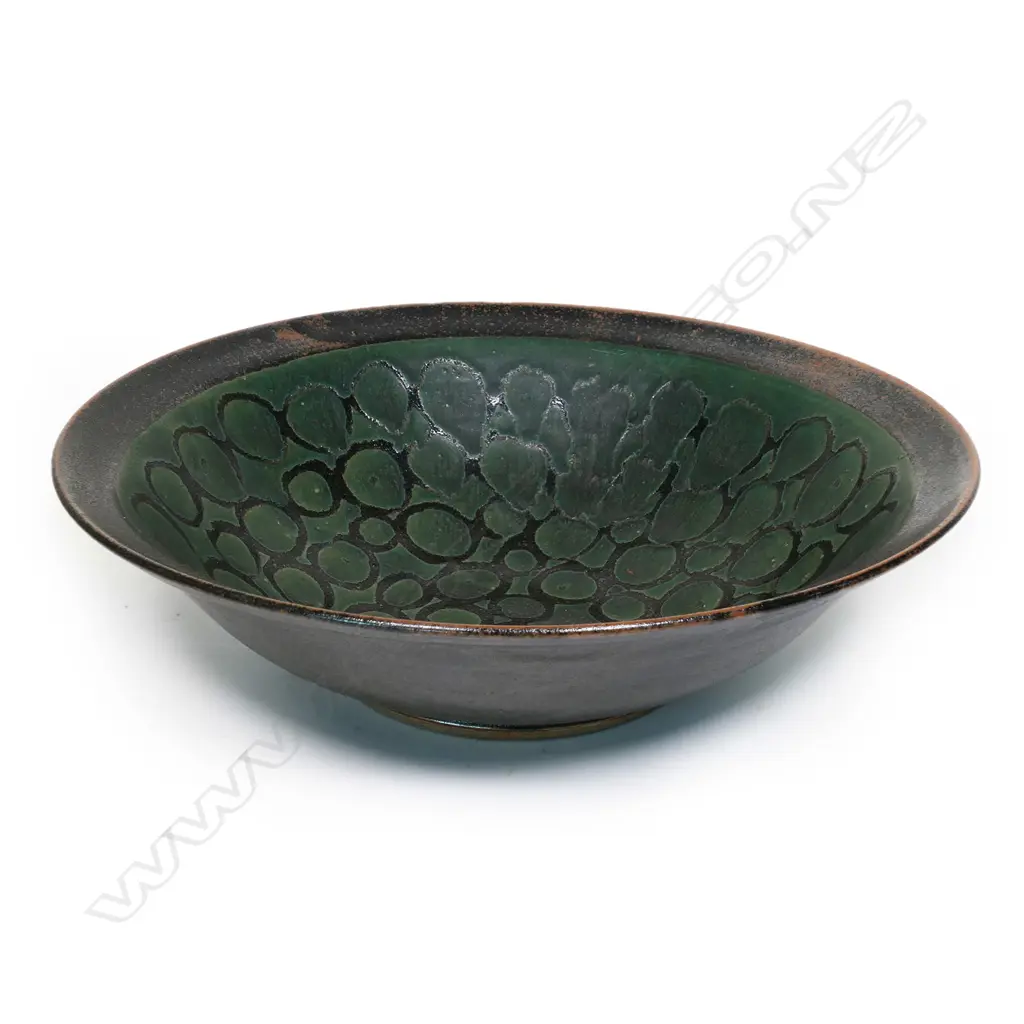Graeme Storm large bowl - wax resist green glaze patterned decoration on iron glaze ground. Impressed potter's mark. Dia.375mm. Image 1++