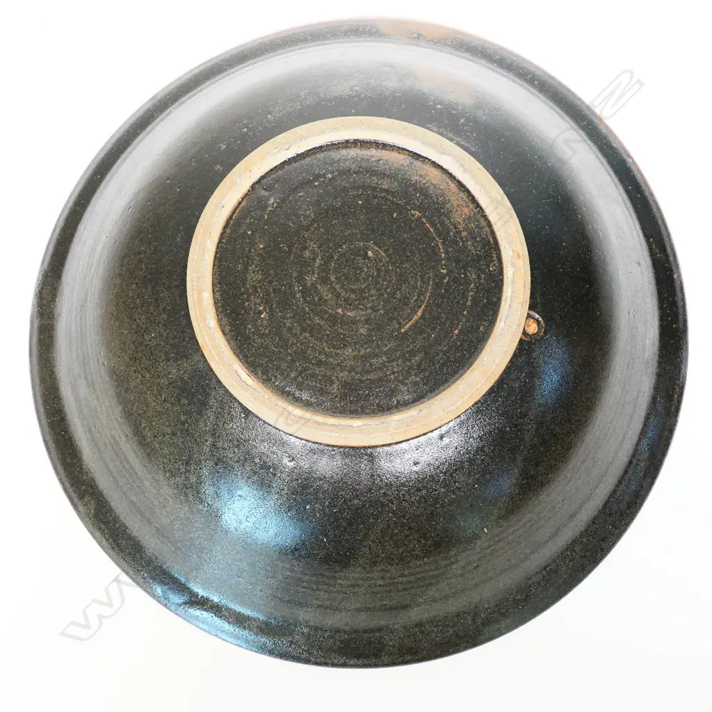 Graeme Storm large bowl - wax resist green glaze patterned decoration on iron glaze ground. Impressed potter's mark. Dia.375mm. Image 1++