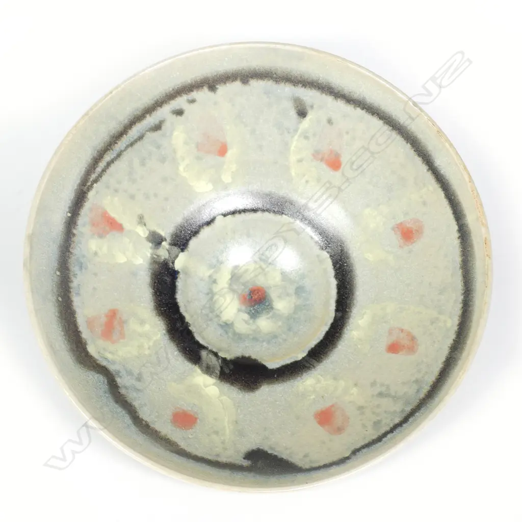 Doreen Blumhardt (1914-2009) flared pedestal bowl. The interior with red dots highlighted with yellow and with dark bands. Impressed potters mark. Dia.248mm. Image 1++