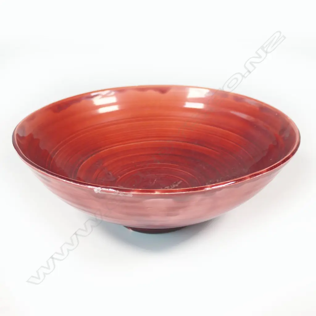 Doreen Blumhardt (1914-2009) red glazed flared bowl c.1960 - incised potter's mark within the foot. Dia.195mm. Tiny flake chip to foot. Provenance: Ex. The estate of Eleanor Blumhardt - the potter's sister. Image 1++